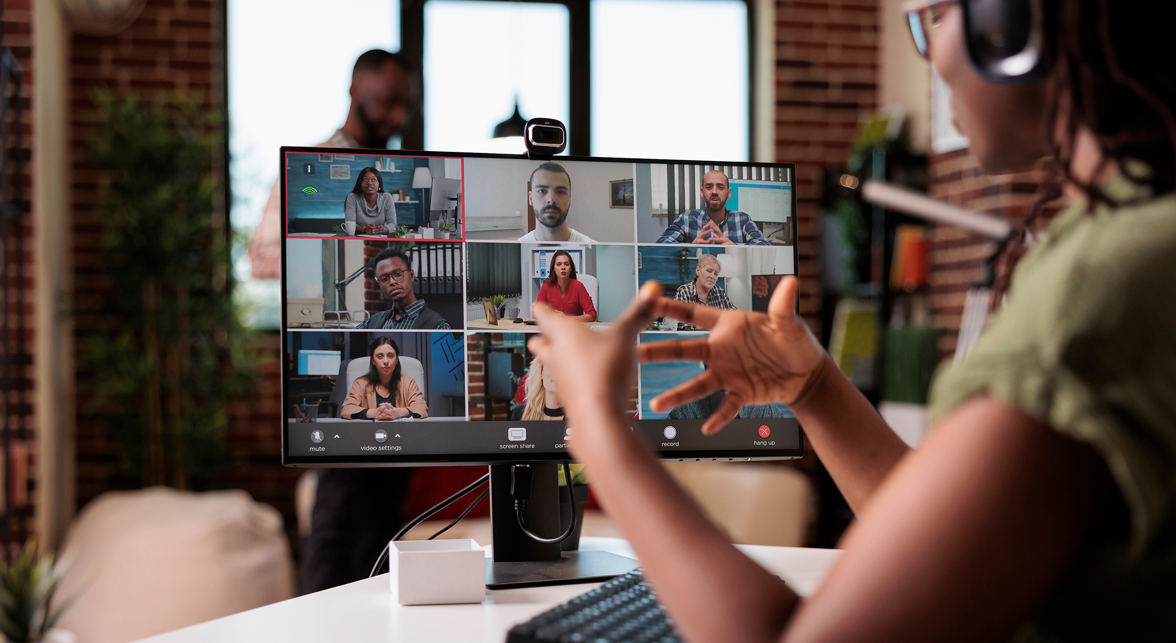 Leader presenting on a video call with her team